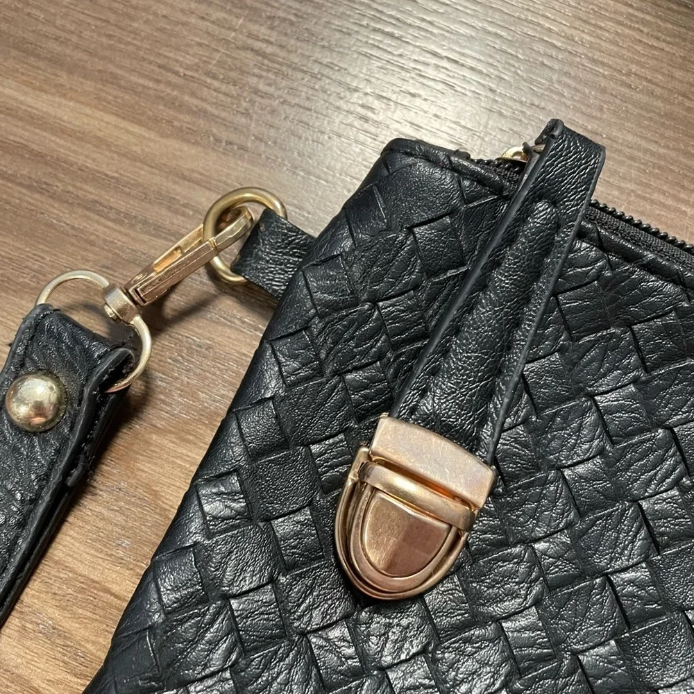 Small Black Pattern Wristlet With Zipper & Metal Clasp Closure.